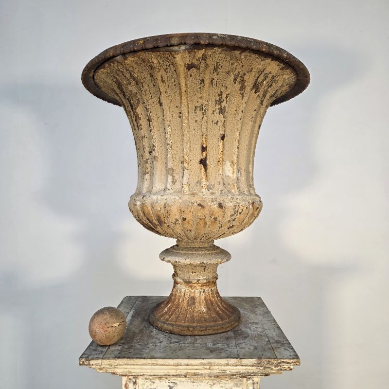 Large 19th century cast iron urn. Alternate view